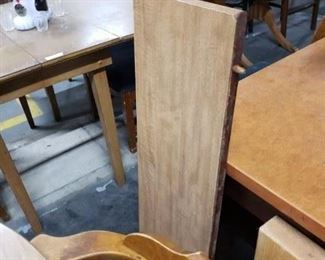 Solid Oak Table with Wood Grain style laminate top with leaf & 4 solid wood Captains armchairs Table 42" diameter Leaf 10" W       $295