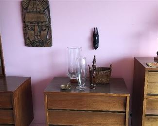 African statues, Mid Century Modern dressers, chests, highboy. African masks. Glassware.