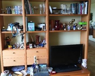 Wall unit with small doo dads TV brass metals pottery 
