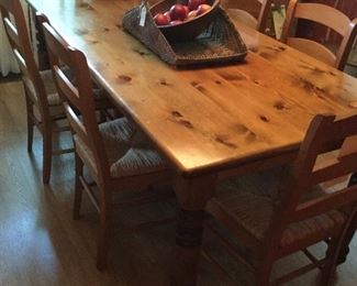 Pine harvest table with 6 woven seat chairs 