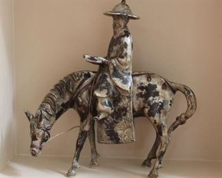 #5. $175.00. Heavy metal horse with rider figure 18” h  X 17.5” long