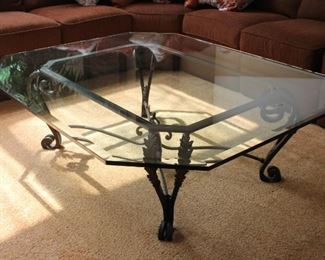 #14. $600.00.  Glass top table with bevel on metal bronze patina  base  19.5” X 61.5”w X 51”d