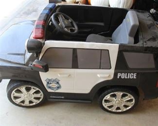 #56.  $125.00. Electric childs police car
