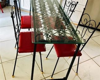 $450 Vintage metal/glass table and chairs. Table 52" L, 19" W, 31" H. 