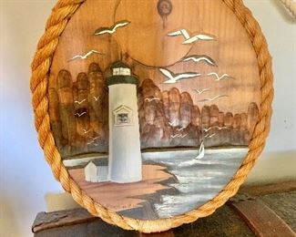 $40 Painted lighthouse scene with rope frame: 12.5" W x 15" H. 