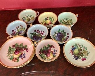 Pastel fruit cups and saucers.  Cups 2.5" H, 4" diam;  saucers 6" diam. 