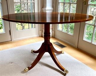 Item 9: Vintage Banded Inlay Pedestal Table with Brass Casters - 48"l x 21"w x 29.5"h - very good condition: $625