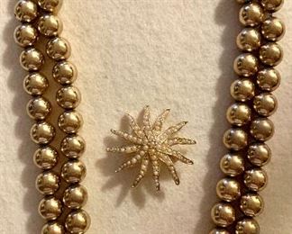 Lot 6: Chunky gold double strand necklace with star shaped seed pearl pin: $24