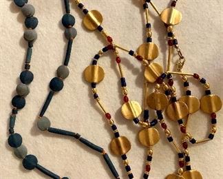 Lot 9: Two great necklaces - long - one on left seem to be clay beads, one on right metal and beads: $28