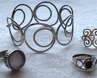 Jewelry 15: Sterling lot - Bracelet and three rings, one with rose quartz and the other a purple stone: $40