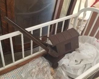 Vintage steam shovel toy; white wooden crib