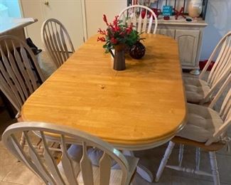 Dining room table with 6 chairs, and two leafs