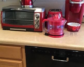 Kitchen appliances including a toaster, Keurig, and toaster oven.