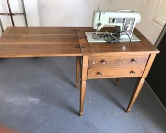 Sewing machine with cabinet, but the cabinet needs repair