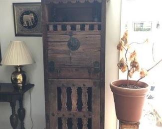 A Spanish Revival "secretary" drop down, in dining room.