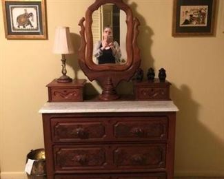 Victorian chest with marble top and dressing mirror in the upstairs bedroom. There is a matching 3 drawer chest with marble top but nothing more in a bedroom downstairs.