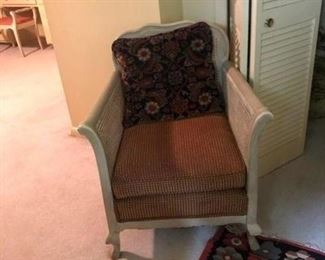 The sitting room off of the upstairs master bedroom has a 2 piece set of painted-wood framed sofa and chair.