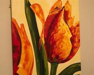 One of three colorful flower paintings hanging together in the downstairs den.