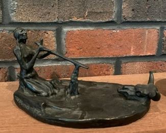 Indian smoking a peace pipe by Russell, Remington bronze
