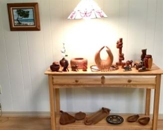 Console table (Sold), signed carved wood items, hanging lamp