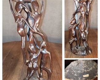 15" walnut carved wood stacked people statue (1 crack) $25