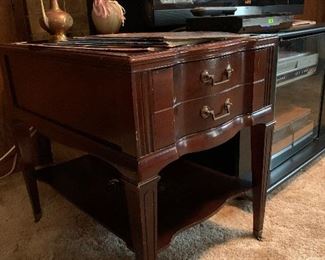 Single drawer mahogany end table with leather top on casters