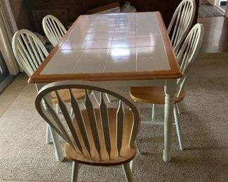 Tile top dining table with five chairs