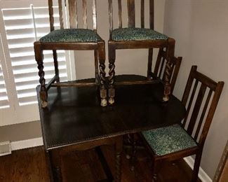 Antique Table from England.  Matching 4 chairs with twisted spindle style legs.