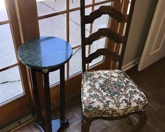 High back chair compliments the secretary.  Marble top plant stand.