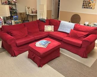 Red sofa and matching storage ottoman