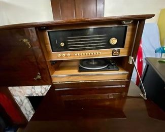 The other side folds down for the record player itself and radio. RARE!