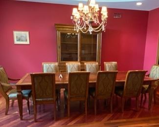Lot 1501 Asking $4,250.00 Gorgeous Ethan Allen Townhouse Dining Table with 2 Leaves, 2 Adison Arm Chairs & 8 Dining Chairs in addition to the Townhouse Sliding Cabinet Doors Cabinet/China Hutch and custom pads for the table.72" x 46" w/o Leaves, Each Leaf 24" 120" total with 2 Leaves. Chhina Hutch 85" W x 19" D x 75" H