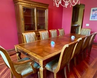 Lot 1501 Asking $4,250.00 OBO Gorgeous Ethan Allen Townhouse Line Dining Table with 2 Leaves and 2 Adison Arm Chairs & 8 side Chairs in addition to the Townhouse China Hutch/Buffet. Sliding Cabinet Doors on the base, a lit top for showing off your treasures, and custom pads for the table.The table is nicely framed with burled wood around the perimeter. You can feed a throng sitting at this table - the chairs are still being sold at Ethan Allen, and these are upholstered with a premium fabric. Perfect Shape, ready to entertain.