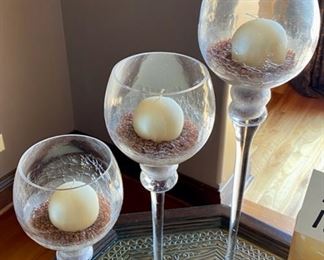 Lot 1507 $30.00. Trio of Candle Holders with long stems includes Circular Candles. 19.5" T x 4" Diam., 16" T x 4" Diam., 12" T x 4" Diam.