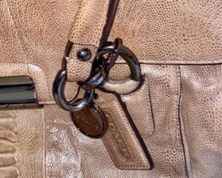 Lot 1521 $65.00. Authentic Coach Pebble Leather with Snake Skin treatment in the center of the bag. 2 Handles, plus removable shoulder strap. Excellent Condition, Official Coach Fob and Leather Tag. Front Flap with interesting metal closure, and handy Inside Zipper Compartments. Perfect for Fall!