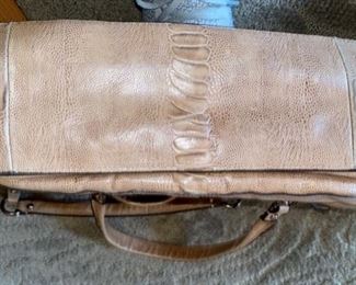 Lot 1521 $65.00. Authentic Coach Pebble Leather with Snake Skin treatment in the center of the bag. 2 Handles, plus removable shoulder strap. Excellent Condition, Official Coach Fob and Leather Tag. Front Flap with interesting metal closure, and handy Inside Zipper Compartments. Perfect for Fall!