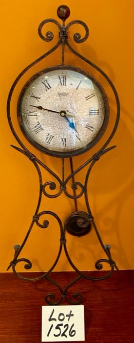 Lot 1526 $ 40.00 Metal Eiffel Tower Art and Clock with Pendulum and White Face. Battery Operated. Tower: 26.5" T x 12" W Clock: 28.5" T x 11" W