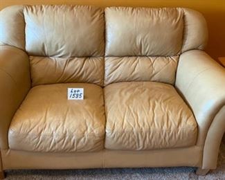 Lot 1535 $400.00 Matching Tan Leather 2 Cushion Love Seat with Rolled Arms and Attached Comfy Cushions in Great Shape and Color. 69" L x 40" H Seat Back x 38" D, Cushion 24" D x 17" H to Seat Cushion.