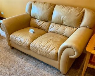 ot 1535 $400.00 Matching Tan Leather 2 Cushion Love Seat with Rolled Arms and Attached Comfy Cushions in Great Shape and Color. 69" L x 40" H Seat Back x 38" D, Cushion 24" D x 17" H to Seat Cushion.