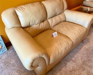 ot 1535 $400.00 Matching Tan Leather 2 Cushion Love Seat with Rolled Arms and Attached Comfy Cushions in Great Shape and Color. 69" L x 40" H Seat Back x 38" D, Cushion 24" D x 17" H to Seat Cushion.
