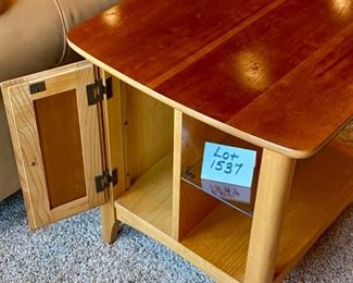 Lot 1537 $75.00 Maple Side Table w/ 1 Door in Front and Back, Glass Shelf, Maple and Cherry Veneers, The Top Surface shows wear and rough spots. Made by Riverside Furniture 26" D x 22" W x 24" H