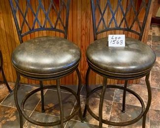 Lot 1563. $180.00. Set of two Premier 30" Atrium Rounded Swivel Bar Stools made of Wrought Iron with Full Back Support, Interwoven Lattice Pattern Back in Autumn Rust Finish and Coffee Colored Vinyl Upholstery. 30" H Seat, 18" Diameter Seat, 46" H on Back Rest