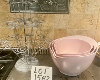 Lot 1582 $30.00 Wilton Wire Cupcake Holder, so cute, and Melamine Mixing Bowl Set of 3 from Williams-Sonoma, in pink. Smallest size has hairline crack in middle, still holds liquid so should be functional - everything else is terrific. Darling Set, with stoppers on the bottom of each bowl so they don't skid around while using.