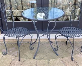 Lot 1584 $150.00  Wrought Iron Bistro Table with Glass Top and 2 Wrought Iron Chairs