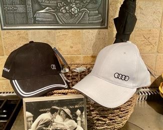 Lot 1614 $28.00. 4 piece Lot includes a Pair of the Audi Baseball Caps, Framed Photo Decor and Umbrella. We also have 2 Sets Audi Q3 Floor Mats (Never Used)