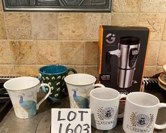 Lot 1603. Asking $28. Smart Gear Heated Travel Mug, New in Box, 2 Mugs Alumni from Truman State University, 1 Cool Peacock Shaped mug in relief, and 2 Peacock decorated mugs