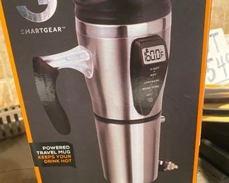 Lot 1603. Asking $28 for all. Smart Gear Heated Travel Mug, New in Box, 2 Mugs Alumni from Truman State University, 1 Cool Peacock Shaped mug in relief, and 2 Peacock decorated mugs