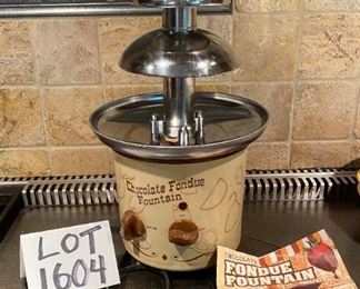 Lot 1604. The best $30 you will ever spend! Yum! Kids and Grandkids love this! Chocolate Fondue Fountain by Nostalgia Electrics