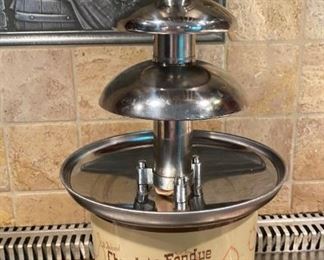 Lot 1604. The best $30 you will ever spend! Yum! Kids and Grandkids love this! Chocolate Fondue Fountain by Nostalgia Electrics