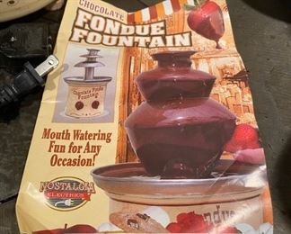 Lot 1604. The best $30 you will ever spend! Yum! Kids and Grandkids love this! Chocolate Fondue Fountain by Nostalgia Electrics